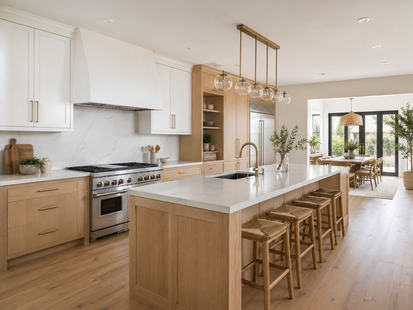 Wide view of a remodeled kitchen showing lighting, flooring and layout